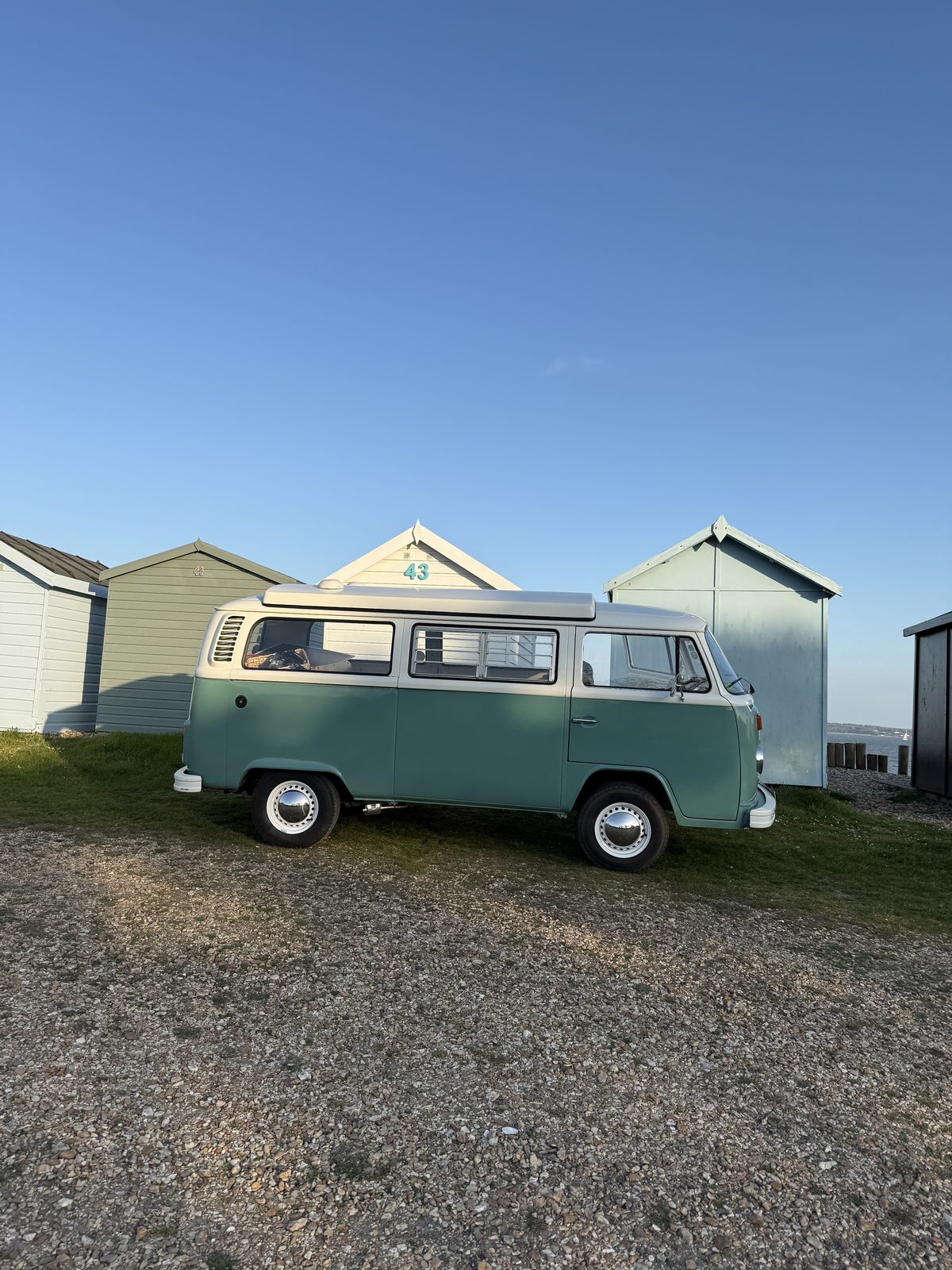 Jenny the Bus - 1976 VW Bay Window campervan by the beach huts after restoration