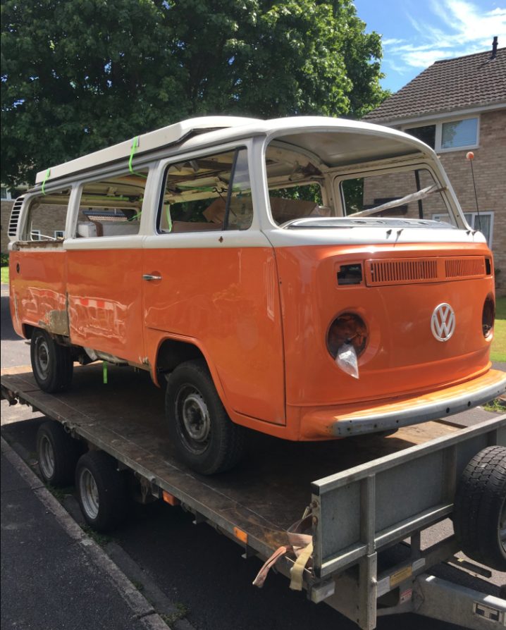 Jenny when she arrived — orange 1976 VW Bay Window on a trailer before restoration