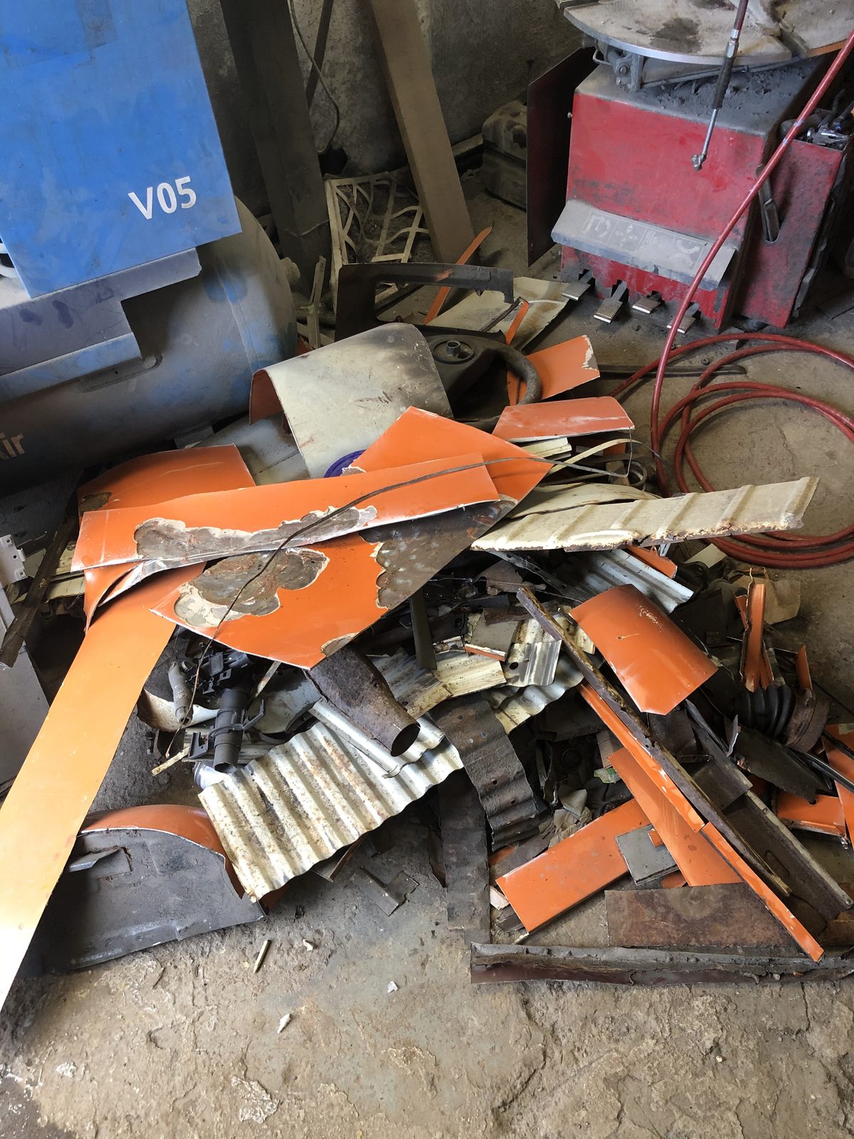 Rusty metal panels cut away from Jenny — the result of missed rust during inspection