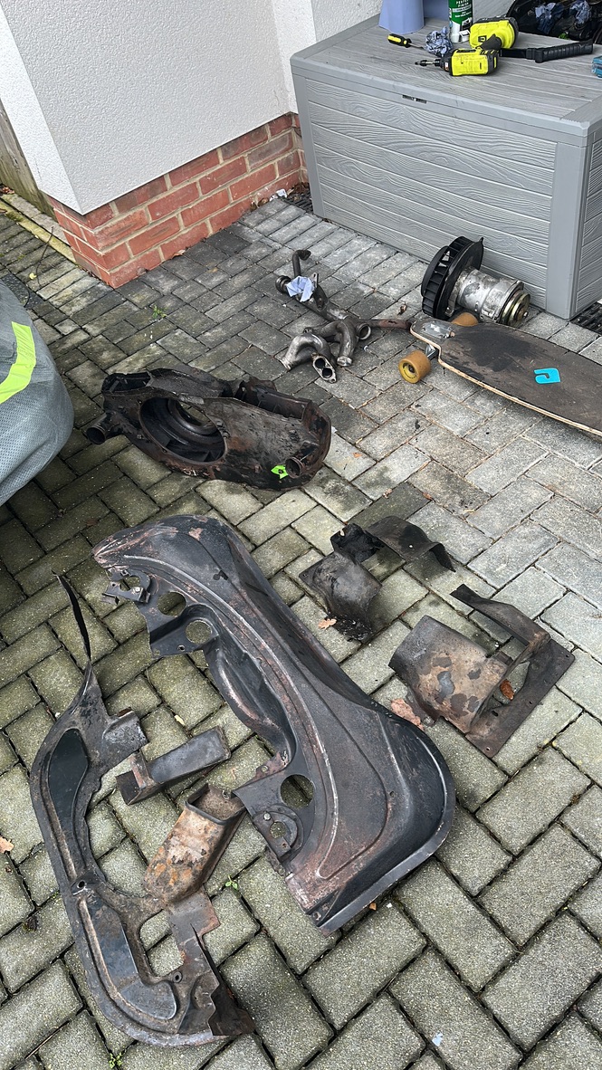 Piles of rusty oily tinware from VW engine