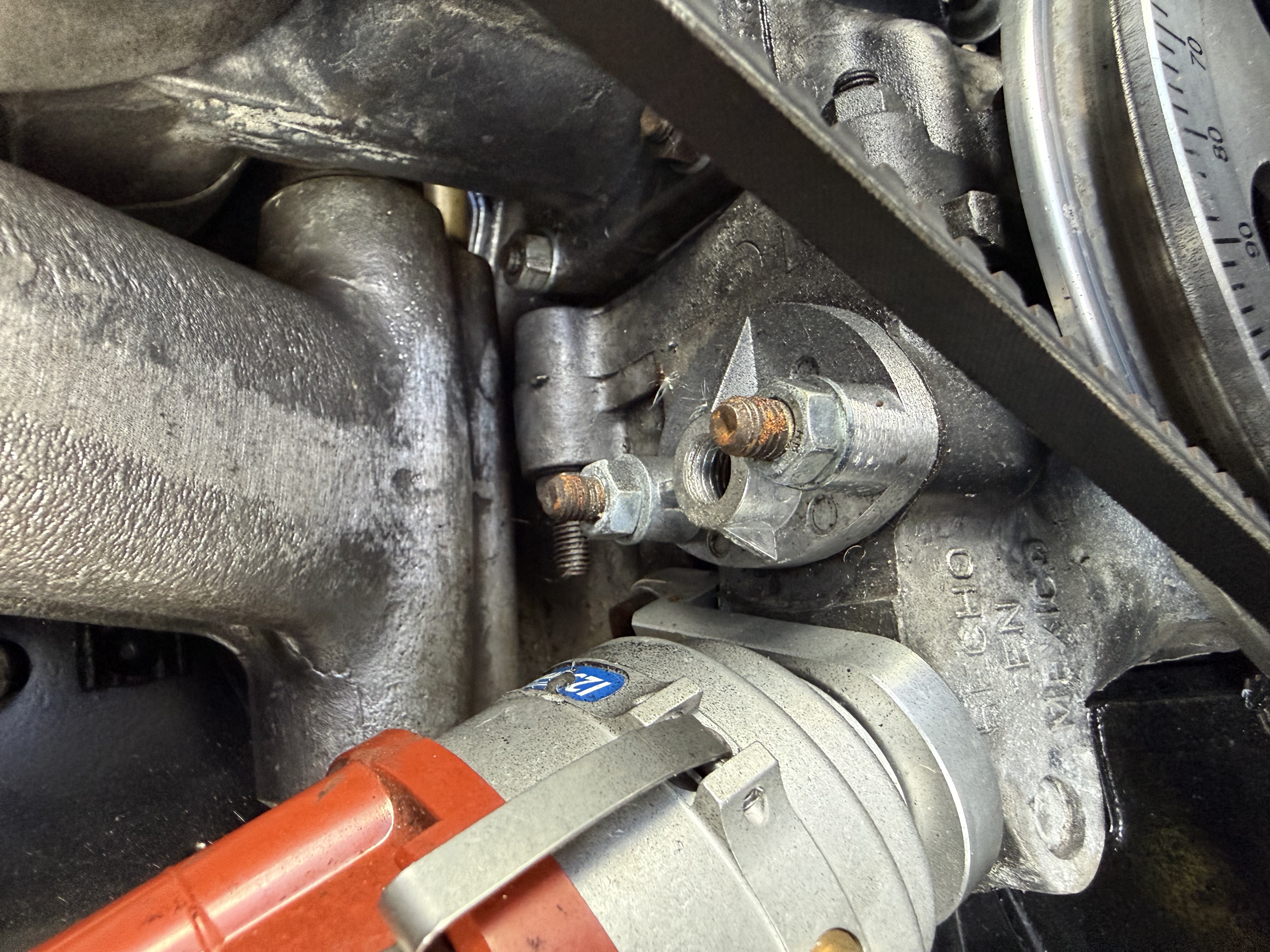 Malpassi regulator detail showing adjustment screw and fuel inlet/outlet connections for pressure calibration