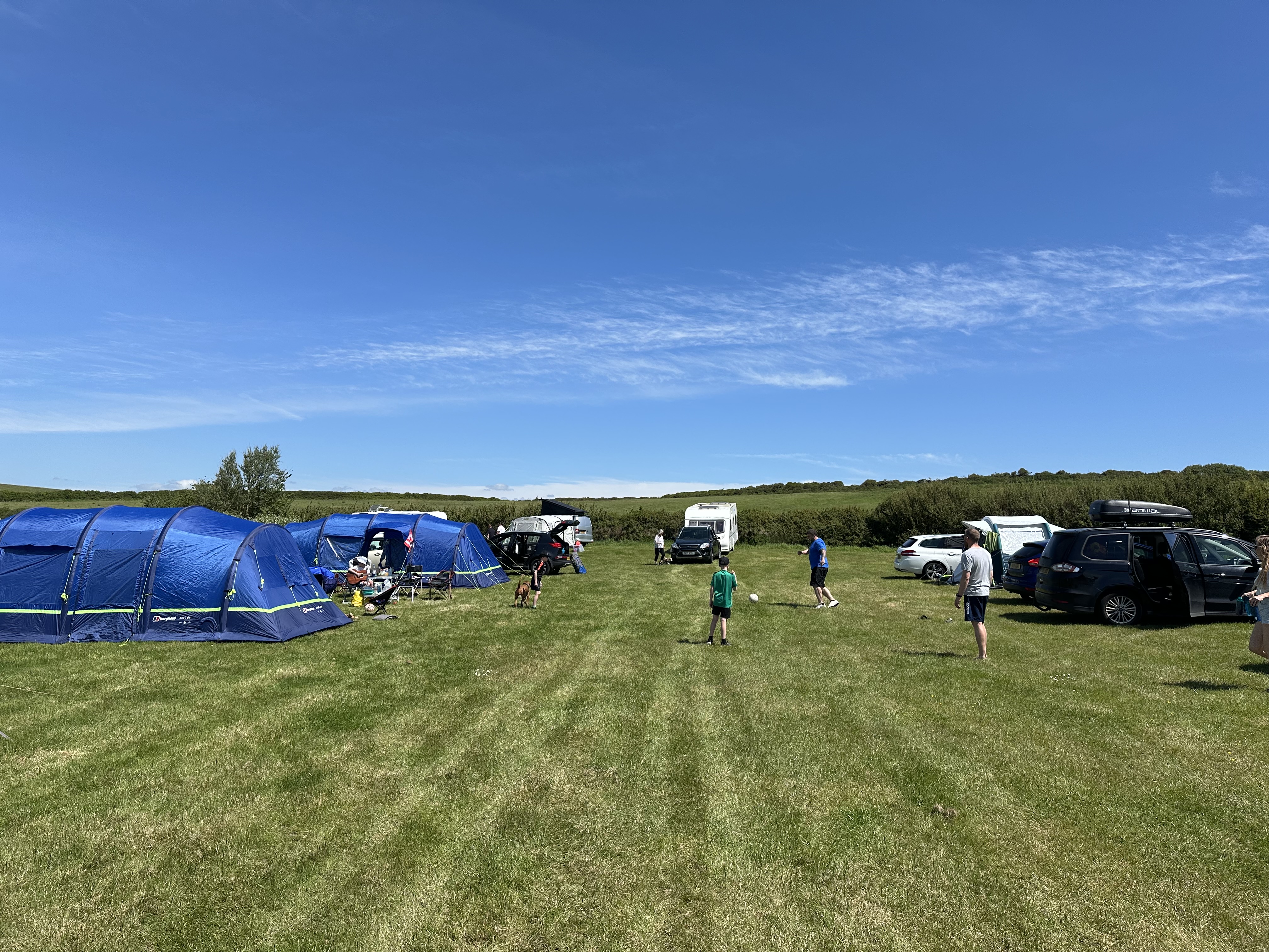 Jenny at a beautiful campsite on a sunny day